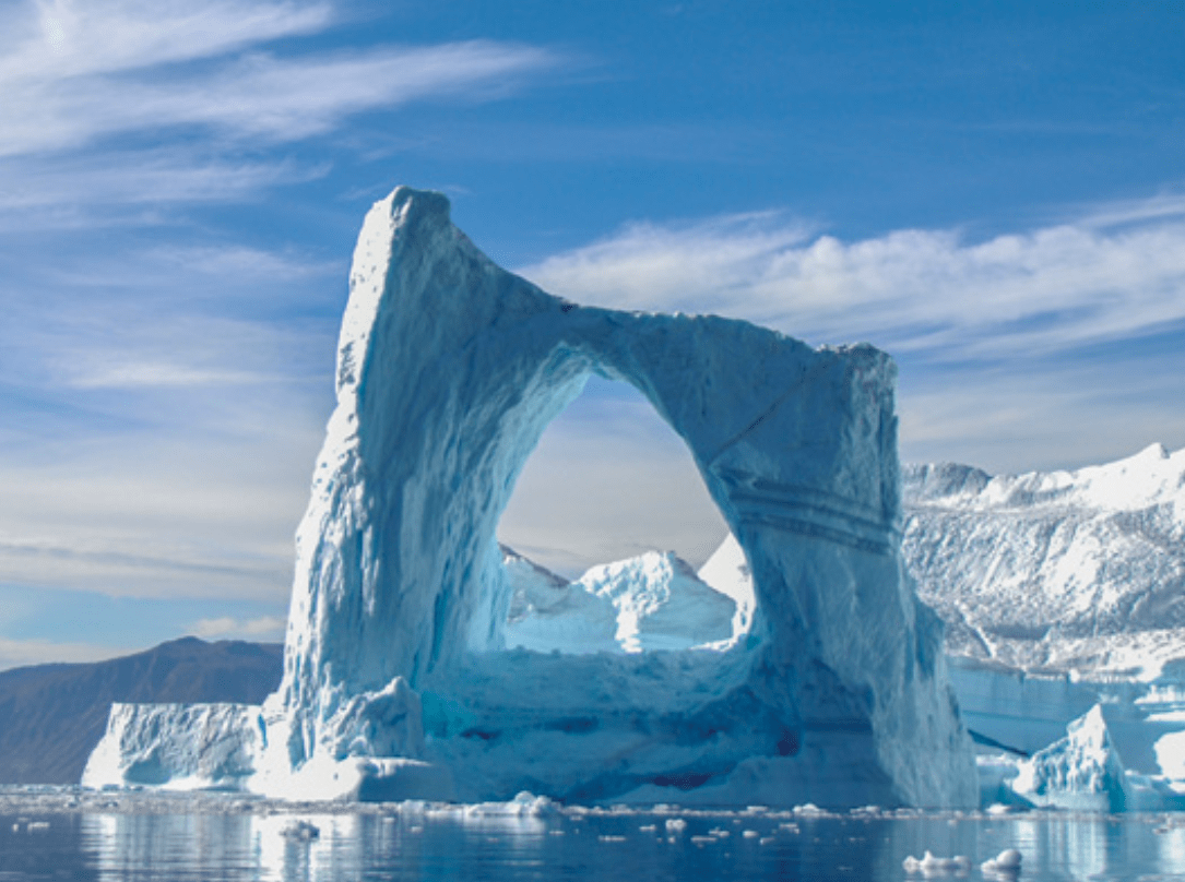 A natural arch forms out of ice in Greenland